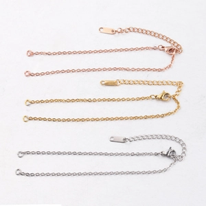 Macro view of 2mm stainless steel chains in rose gold, gold, and silver finishes