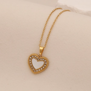 Golden stainless steel heart pendant necklace with shimmering white shell and small crystals
