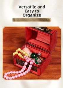 Red vintage wooden jewelry box with antique metal clasp and traditional floral patterns