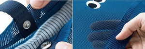 Close-up of blue mesh beach bag featuring reinforced nylon edges and silver metal snap button