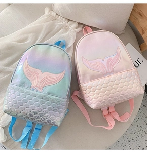 Detail of mermaid tail embroidery and laser scale texture on iridescent backpacks