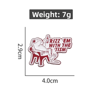 Detail of cartoon frog enamel pin on a red chair with RIZZ 'EM WITH THE 'TISM text