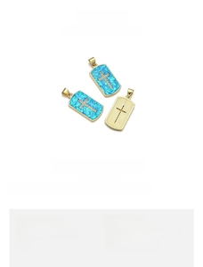Detail of 13x26mm 18K gold plated copper cross pendant with blue opal and zircon stones