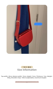 Detailed dimension chart showing bag size, strap length, and weight for red saddle bag