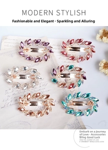 Macro shot of six assorted rhinestone spring hair clips on vintage decorative background