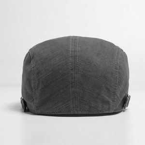 Men's dark gray cotton newsboy cap featuring adjustable metal buckles and rear stitching