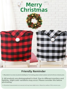 Detail view of red and black buffalo check Christmas chair covers with white pom poms