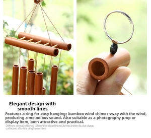 Detailed view of natural bamboo wind chime with metal rings and smooth brown tubes