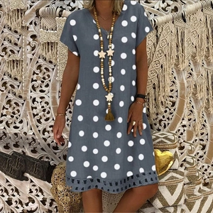 Grey V-neck short sleeve dress with white polka dots and laser-cut hollow hem detail
