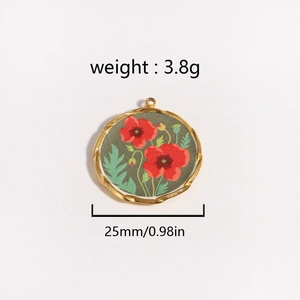 Detail view of 25mm gold titanium pendant featuring red poppy flower design and 3.8g weight