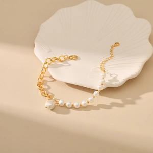 Baroque pearl bracelet with gold chain stitching and 18K gold plated O-chain design