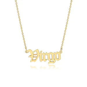 Detailed close-up of a gold Virgo zodiac sign pendant on a delicate link chain necklace