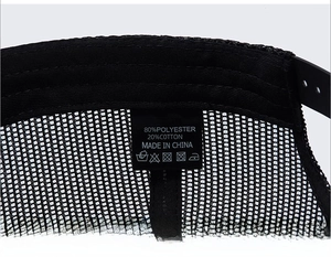 Detail view of the breathable mesh back and adjustable snapback closure on a trucker cap