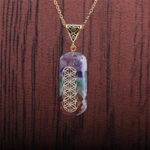 Detailed close-up of colorful crystal stone necklace with golden Flower of Life pendant