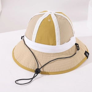 Detail of color-block kids bucket hat with adjustable windproof rope and side label