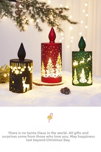 Three LED Christmas candles with reindeer and Santa graphics in red, green, and black
