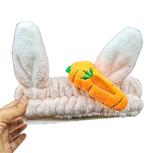 Cute bunny ear plush headband with carrot decor made of soft pink coral fleece fabric