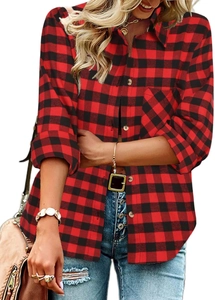 Detailed macro view of classic red and black plaid shirt fabric with buttoned chest pocket