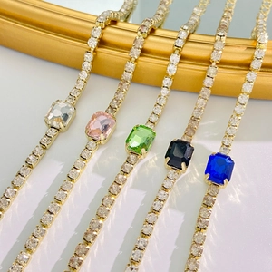 Gold tennis chain bracelets with vibrant rectangular emerald cut cubic zirconia stones