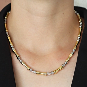 Collana bicolore a maglie di bambù con perle d'argento e tubi dorati da donna