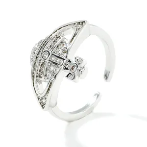 Macro detail of saturn planet ring with sparkling cubic zirconia stones and sizing specs