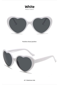 Front and side view of stylish heart-shaped sunglasses with white frames and dark lenses