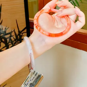 Minimalist resin round bangles with orange and purple marble texture in New Chinese style