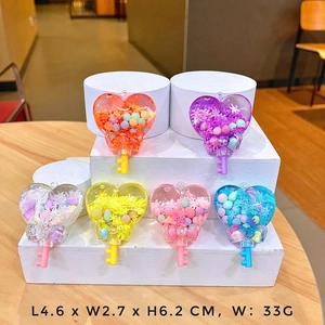 Colorful luminous sand heart-shaped key charms made of resin with star sequins