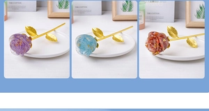 Detailed view of resin roses with natural crystal chips and golden foil stems