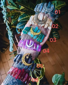 Selection of six moon crystal hair combs in various colors shown on a person's arm