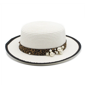 White flat top straw sun hat with leopard ribbon, pearls and floral accents