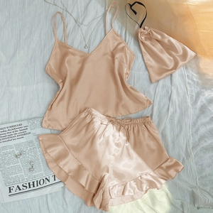 Champagne silk satin pajama set with camisole top and ruffled shorts for summer comfort