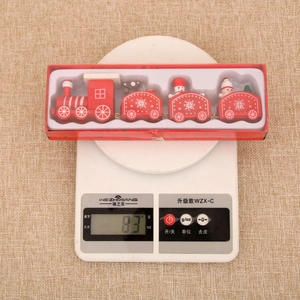 Detailed top view of a wooden Christmas train set in a red gift box weighing 83 grams