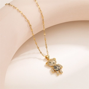 Close-up of golden movable bear pendant necklace with sparkling micro-pave zircons