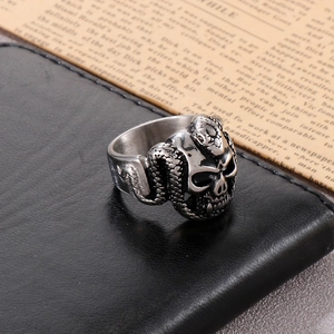 Close-up of hip-hop skull and snake ring made of stainless steel with gothic dark style