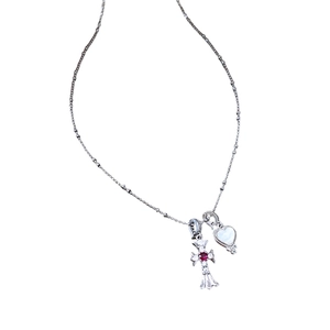Silver necklace with zircon cross and mother of pearl heart pendants on white background