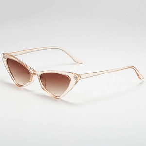 Fashionable cat eye sunglasses with champagne transparent frames and brown gradient lenses