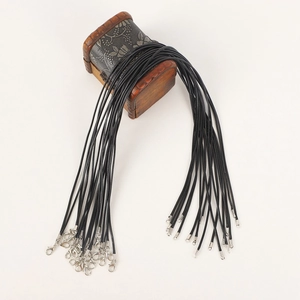 Detail of black wax cord necklace with silver lobster clasps and extension chains
