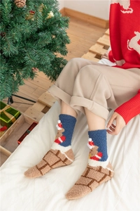 Detailed view of warm blue Christmas coral fleece socks with cute reindeer patterns