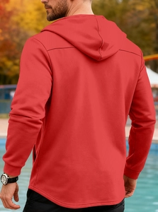 Rear view of red slim-fit hooded jacket featuring ribbed cuffs and outdoor casual style
