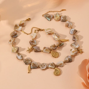 Fashionable shell necklace and bracelet set with golden starfish and conch pendants