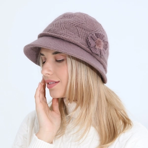 Detail of elegant knit bucket hat with floral decor and thick fleece lining in purple