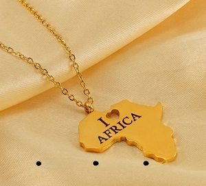 Polished gold stainless steel Africa map necklace detail with I Love Africa engraving