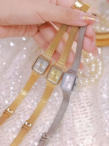 Detailed shot of three luxury women rectangular quartz watches with diamond-set bezels