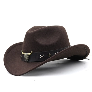 Brown western cowboy hat with vintage bull head emblem and leather star studded band