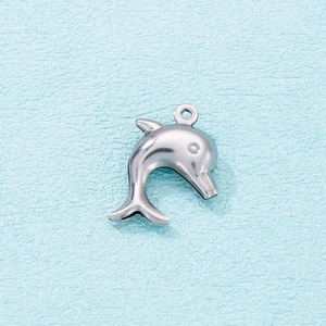 Close-up of a hollow dolphin pendant in silver stainless steel with top connector ring