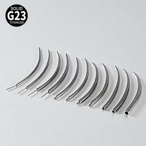 Macro detail of various G23 titanium piercing insertion pins and taper tools