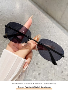 Close-up of rimless oval sunglasses with purple lenses and sleek black metal bridge