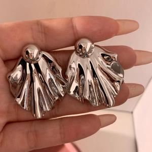 Irregular textured silver stainless steel earrings with fluid shell-like ripple design