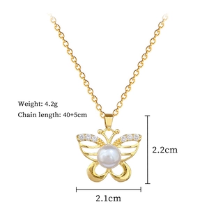 Detailed view of butterfly pendant with pearl and zircon showing 2.1x2.2cm dimensions